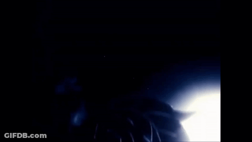 A Close Up Of A Person 'S Face With Many Eyes And A Finger On Their Mouth GIF