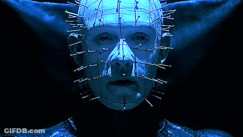 A Close Up Of A Person 'S Face With Nails In It 'S Head GIF