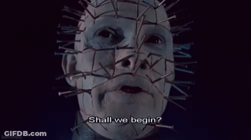 A Close Up Of A Person 'S Face With Nails On It And The Words `` Shall We Begin ? '' GIF