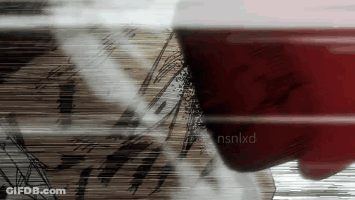 A Close Up Of A Person 'S Face With Nsnlxd Written On The Bottom Right GIF