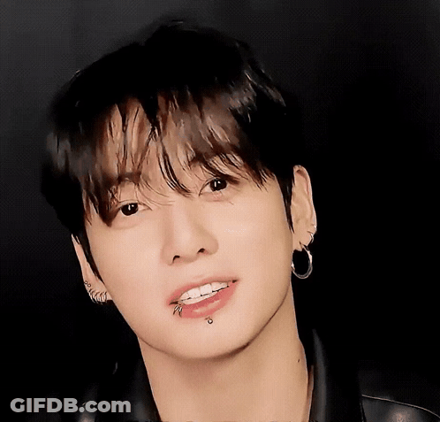 A Close Up Of A Person 'S Face With Piercings GIF