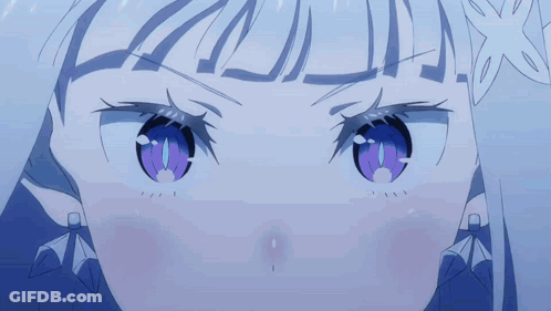 A Close Up Of A Person 'S Face With Purple Eyes GIF
