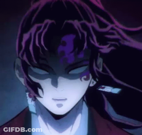 A Close Up Of A Person 'S Face With Purple Hair And A Dark Background . GIF