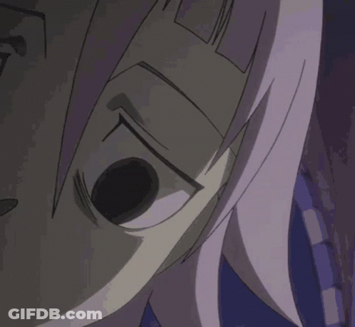 A Close Up Of A Person 'S Face With Purple Hair GIF
