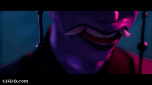 A Close Up Of A Person 'S Face With Purple Lights Behind Them GIF