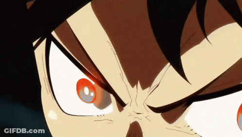 A Close Up Of A Person 'S Face With Red Eyes And A Black Background GIF