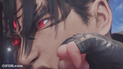 A Close Up Of A Person 'S Face With Red Eyes And Black Hair GIF