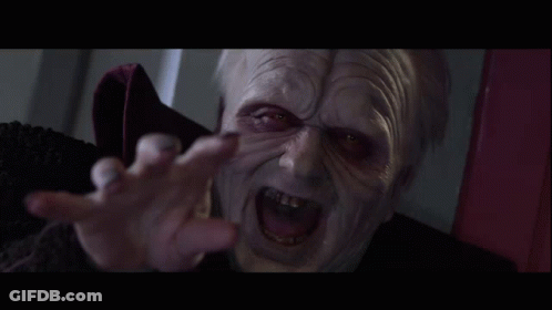 A Close Up Of A Person 'S Face With Red Eyes And Gray Hair GIF
