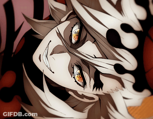 A Close Up Of A Person 'S Face With Red Eyes And White Hair GIF