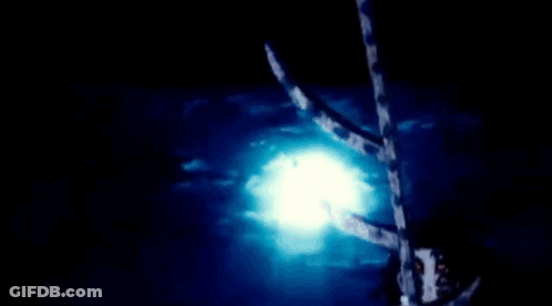 A Close Up Of A Person 'S Face With Red Eyes In A Dark Room . GIF