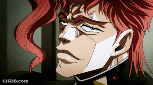 A Close Up Of A Person 'S Face With Red Hair And A Cherry Earring GIF