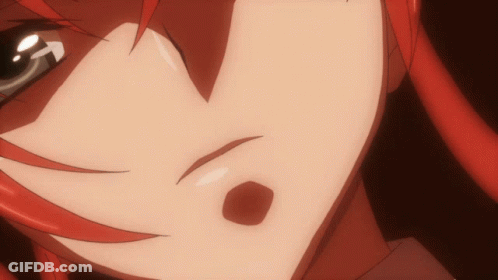 A Close Up Of A Person 'S Face With Red Hair And A Red Spot GIF