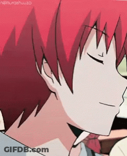 A Close Up Of A Person 'S Face With Red Hair And Eyes Closed . GIF