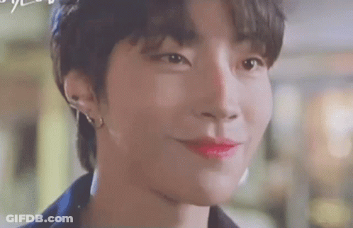 A Close Up Of A Person 'S Face With Red Lipstick On . GIF
