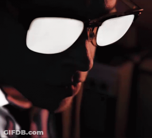 A Close Up Of A Person 'S Face With Sunglasses On Their Eyes GIF
