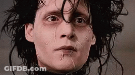 A Close Up Of A Person 'S Face With Tears Coming Out Of Their Eyes . GIF