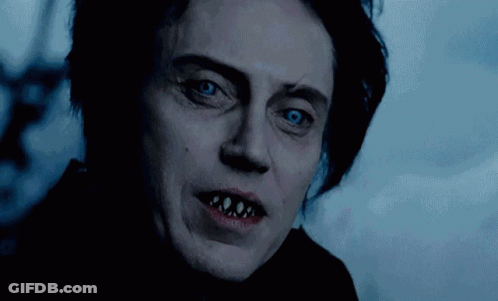 A Close Up Of A Person 'S Face With Teeth Showing GIF