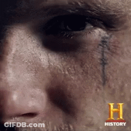 A Close Up Of A Person 'S Face With The Letter H On The Bottom GIF