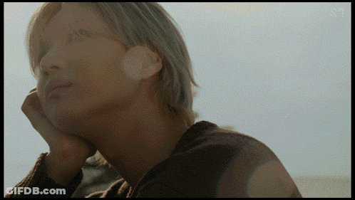 A Close Up Of A Person 'S Face With The Letters Sm On The Bottom Right GIF