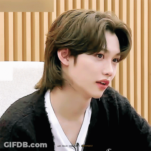 A Close Up Of A Person 'S Face With The Name Lee Felix On The Bottom Right GIF