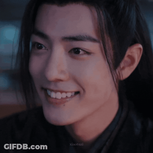 A Close Up Of A Person 'S Face With The Name Xiaotuzi Written On The Bottom GIF