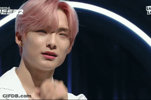 A Close Up Of A Person 'S Face With The Number 2 On The Bottom Right GIF