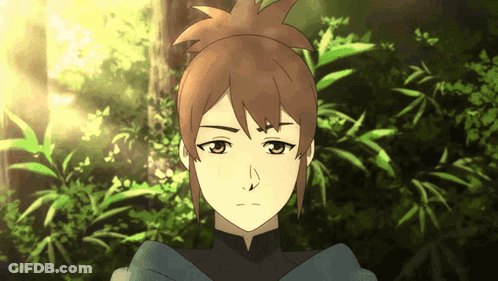 A Close Up Of A Person 'S Face With The Sun Shining Through The Trees GIF