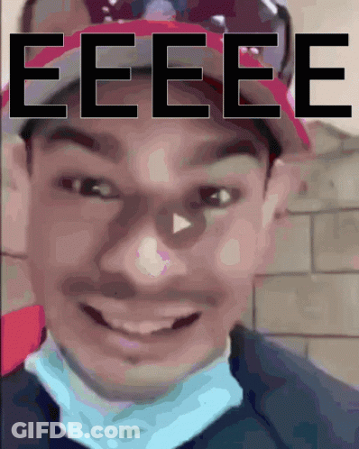 A Close Up Of A Person 'S Face With The Word Eeee Written Above It GIF