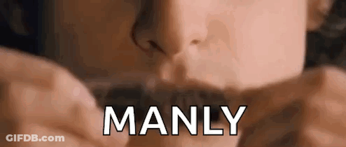 A Close Up Of A Person 'S Face With The Word Manly Written In White Letters . GIF