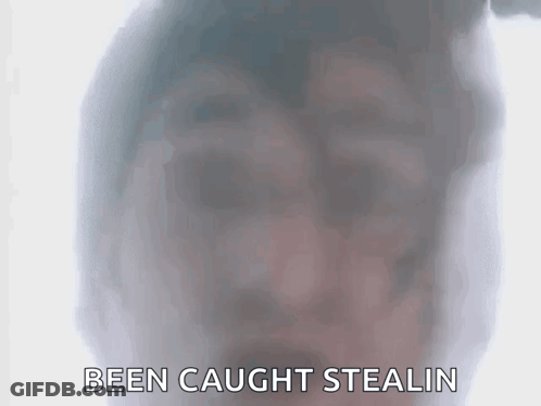 A Close Up Of A Person 'S Face With The Words Been Caught Stealin Written Below It . GIF