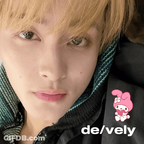 A Close Up Of A Person 'S Face With The Words De / Vely On The Bottom GIF