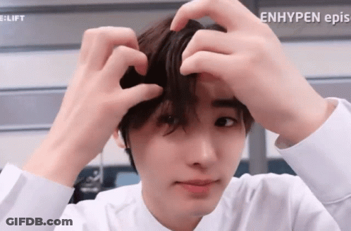 A Close Up Of A Person 'S Face With The Words Enhypen Ep.s. Visible GIF