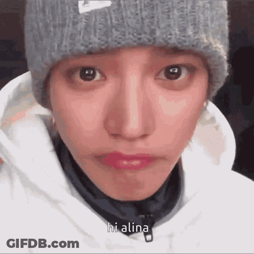 A Close Up Of A Person 'S Face With The Words Hi Alina Written On It GIF
