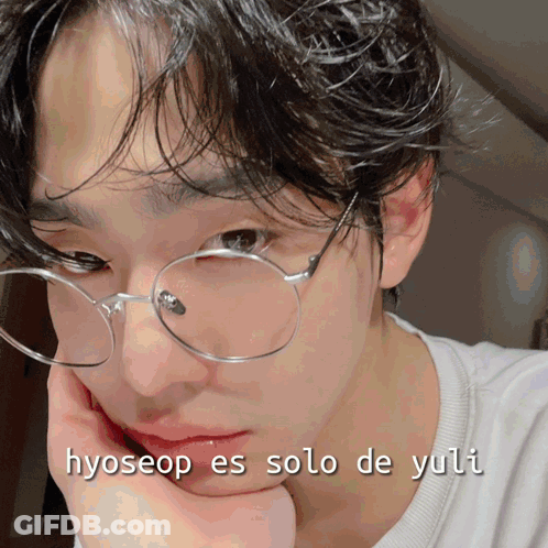 A Close Up Of A Person 'S Face With The Words Hyoseop Es Solo De Yuli Written On The Bottom GIF