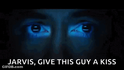 A Close Up Of A Person 'S Face With The Words Jarvis Give This Guy A Kiss Written Below It GIF