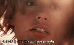 A Close Up Of A Person 'S Face With The Words `` Let 'S Not Get Caught '' Written Above It . GIF