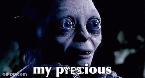 A Close Up Of A Person 'S Face With The Words `` My Precious '' Written On The Bottom . GIF