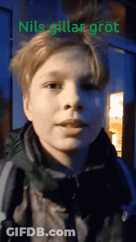 A Close Up Of A Person 'S Face With The Words " Nils Gillar Grot " On The Bottom GIF