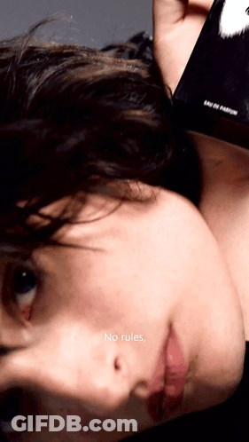 A Close Up Of A Person 'S Face With The Words " No Rules " On The Bottom Right GIF