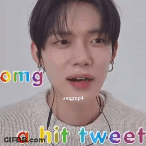 A Close Up Of A Person 'S Face With The Words " Omg A Hit Tweet " Above It GIF