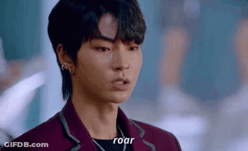 A Close Up Of A Person 'S Face With The Words `` Roar '' Written On The Bottom . GIF
