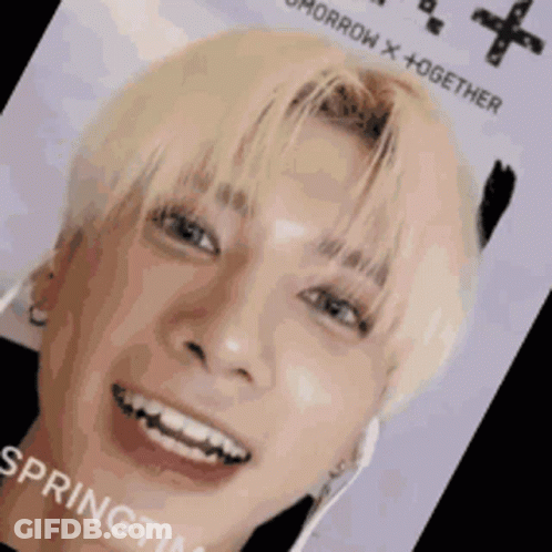A Close Up Of A Person 'S Face With The Words Tomorrow X + Together On It . GIF