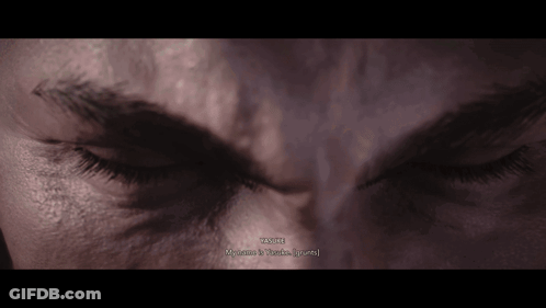 A Close Up Of A Person 'S Face With The Words " Wayne " Written On The Bottom GIF