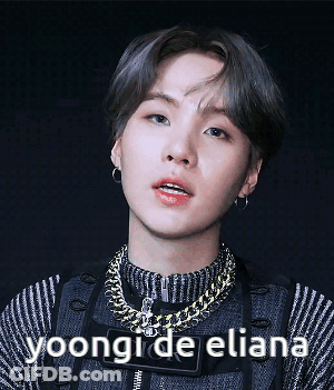 A Close Up Of A Person 'S Face With The Words Yoongi De Eliana Below It GIF