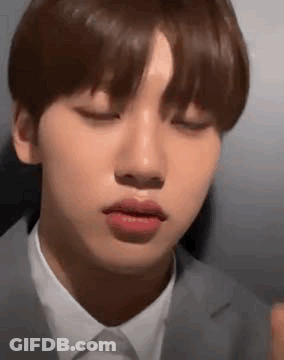 A Close Up Of A Person 'S Face With Their Eyes Closed . GIF