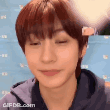 Close Up Of Person With Eyes Closed And Blue Background GIF