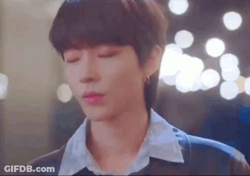 A Close Up Of A Person 'S Face With Their Eyes Closed And A Blurry Background . GIF