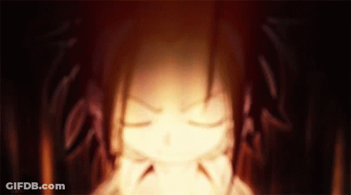 A Close Up Of A Person 'S Face With Their Eyes Closed And A Fire Coming Out Of Their Mouth . GIF