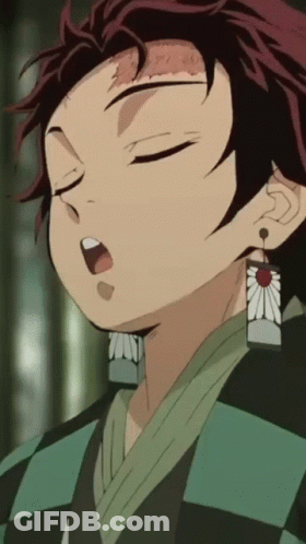 A Close Up Of A Person 'S Face With Their Eyes Closed And A Flower Earring GIF