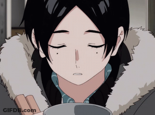 A Close Up Of A Person 'S Face With Their Eyes Closed And A Fur Collar GIF